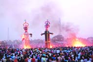 Effigies of demon king being burnt in Amritsar on Thursday. ( R) Spectacular fireworks were the highlight of the function held at Guru Nanak Stadium in Jalandhar.