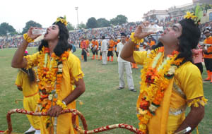 Ramlila artistes quench their thirst ahead of days final performance at Guru Nanak Stadium in Jalandhar on Thursday.