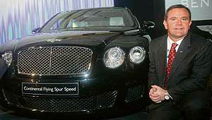 Bentley's regional director for Middle-East, Africa and India, Chris Buxton poses with the "Continental Flying Spur Speed" at its launch in New Delhi on Friday.
