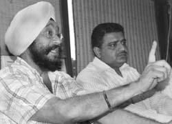 Members of the Banquet Owners Association address a press conference in Mohali 