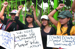 Members of the All-Tribal Students Union, Manipur, sit on dharna during a protest to demand a hill university for tribals in Manipur, at Jantar Mantar in New Delhi on Friday.