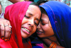 Wife and mother of Kanhayia Lal, who died during the immersion of an idol of Goddess Durga near Loni on Thursday, at their residence in New Delhi on Friday.