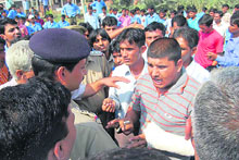 The police tries to pacify students who blocked traffic in Bhiwani on Friday.