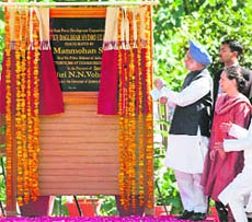 Prime Minister Manmohan Singh inaugurates the 450-MW Baglihar hydel project at Chanderkote, about 150 km from Jammu, on Friday as UPA chairperson Sonia Gandhi looks on.