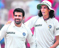 Zaheer Khan and Ishant Sharma celebrate the wicket of Australia's Mike Hussey on the second day of the first Test.