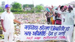 Residents hold a protest against the use of land in front of the martyrs memorial as a garbage dump at Sunet village 