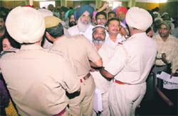 People jostle for their turn to meet Chief Minister Parkash Singh Badal during sangat darshan in Ludhiana
