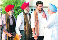 Prime Minister Manmohan Singh greets family members of revolutionaries at the inauguration of an exhibition Sarfaroshi ki Tamanna, at Teen Murti Bhavan in New Delhi on Saturday.