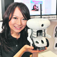 Japan's toy giant Bandai unveils a new robot "NetTansor Web" for home use during the Robo Japan event in Yokohama in Kanagawa prefecture, suburban Tokyo, on Sunday.