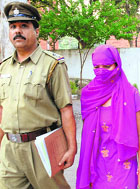 Pushpa Negi being produced at a local court in Chandigarh on Sunday.