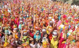Women take part in a Kalash Yatra on the occasion of Shrimadh Bhagwat Katha Gayan Yag at Dundahara in Gurgaon. A total of 11,108 women participated in the yatra. 