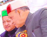 Chief Minister Prem Kumar Dhumal and former Chief Minister Virbhadra Singh during the Guruta Gaddi Divas celebrations in Shimla on Sunday.