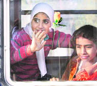 Happiness is writ large on their faces as these children enjoy a ride on the first run of the Kashmir train at Avantipora on Sunday.