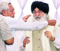 Chiranji Lal Garg, Punjab president, Agarsen Sabha, honours Parkash Singh Badal at a function organised to commemorate the birth anniversary of Maharaja Agarsen at Mohali on Sunday. 