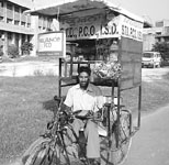 Jaspal Singh on his tricycle (mobile STD ) in district administrative complex, Sangrur.
