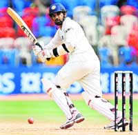 Zaheer Khan plays a shot during the fourth day of the first Test between India and Australia at the M Chinnaswamy Stadium in Bangalore
