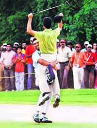 Liang Wen-Chong of China is picked up by his caddy after winning the Hero Honda Indian Open at the Delhi Golf Club in New Delhi on Sunday.