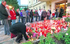 People wait in line to sign the book of condolences in memory of the leader of Austrias Buendnis Zukunft Oesterreich (BZOe) party and Governor Joerg Haider in Klagenfurt on Sunday. Haider, a charismatic populist, helped bring anti-immigrant policies into the European mainstream, was killed in a car accident on Saturday. 