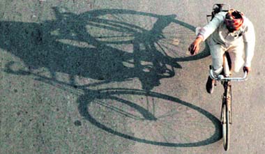 A man pedals down to his home after a days hard work in Chandigarh.