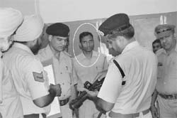 The gunman (in circle) of judicial magistrate Vijay James whose official carbine went off accidentally at the courts complex in Ambala