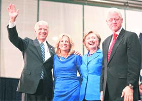 (From left): Democratic vice-presidential candidate Joe Biden, his wife Jill Biden, Hillary Rodham Clinton and her husband former President Bill Clinton wave to the crowd during a campaign rally in Scranton