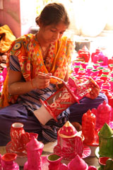 A girl prepares earthen ware or Kurundi for Deepawali in Aggarwal Colony on Tuesday.