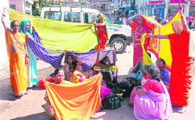 Vaishno Devi pilgrims dry up their clothes at the main bus stand.