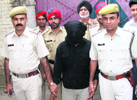 Narinder Singh, a murder accused, in police custody in Ludhiana.