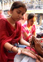 Girls get their hands decorated for Karva Chauth in Bathinda on Wednesday.