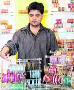 Rahul Abhi, owner of Lakshmi store, showcases the collection of bangles for Karva Chauth. 