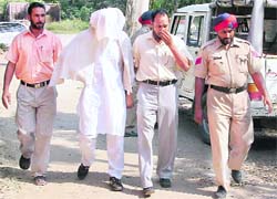 Alleged mastermind of the recent diamond robbery Mohit Sharma being taken to a Phillaur court on Wednesday. 