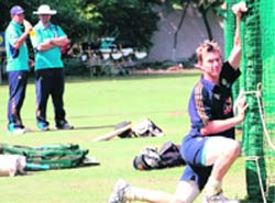 Australian pace spearhead Brett Lee busy doing stretching exercises on Wednesday ahead of the second Test against India at the Punjab Cricket Association Stadium at Mohali
