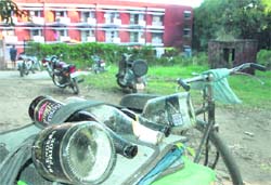 The cycle of a junk dealer laden with empty bottles of liquor sourced from hostels at Panjab University. 