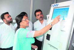 MLA Sumita Singh inaugurates a power bill payment centre in Karnal on Thursday. 