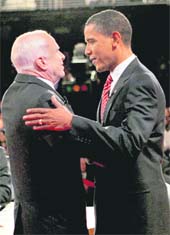 Democratic presidential candidate Barack Obama (R) and Republican presidential candidate John McCain shake hands at the start of the presidential debate at Hofstra University in Hempstead, New York, on Wednesday.