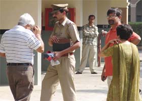 A policeman investigates Regwood Park DLF in Gurgaon where a man committed suicide
