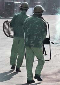 Cops burst tear gas shells to disperse protesters in Srinagar