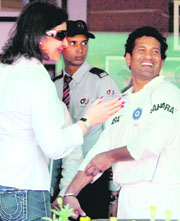 Sachin Tendulkar with his wife at the PCA Stadium in Mohali on Saturday.