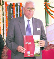 Governor N.N. Vohra releases the university publication at the Baba Ghulam Shah Badshah University in Rajouri on Saturday. 