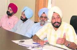 Bahadur Singh, deputy director in the department of rural development and panchayats, Chandigarh, convenes a meeting in Ludhiana
