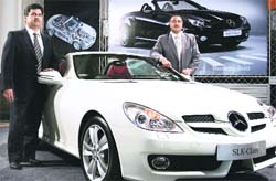 Sanjeev Sahajwala, director, sales and marketing (left) Mercedes Benz India, showcasing the SLK-Class modelon of Mercedes Benz in Ludhiana on Saturday. 