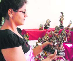 A girl having a look at the articles at display during the ongoing Poompuhar exhibition at Nehru Sidhant Kender in Ludhiana