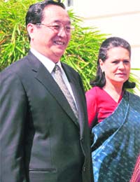 UPA chairperson Sonia Gandhi welcomes Yu Zhengsheng, a member of the Political Bureau of the Central Committee of the Communist Party of China, at her residence in New Delhi