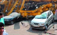 Parked cars which were crushed by the bridge.
