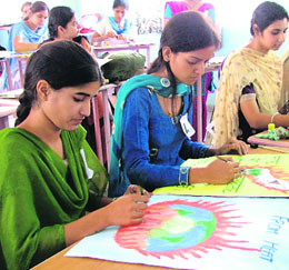 B.Ed students take part in a poster-making competition in Ludhiana on Sunday.