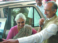 Delhi Chief Minister Sheila Dikshit and DPCC president J.P. Aggarwal arrive to attend the second leg of the monsoon session of Parliament in New Delhi on Monday.