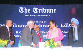 Uttarakhand Chief Minister Major-Gen B.C. Khanduri (Retd) receives an anthology of The Tribune articles from Prof R.P. Bambah at the launch of the papers Dehradun edition.