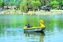 Visitors enjoy boating at Karan Lake in Karnal.