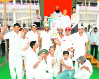 HPCC president Phool Chand Mulana, dera chief Gurmeet Ram Rahim Singh and his son Jasmit Insan along with winners of the first Herbotech Aloe Vera Twenty20 cricket tournament in Sirsa recently.