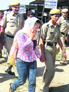 Linda, an accused in the kidney racket case, is taken to the CBI court in Ambala on Monday.